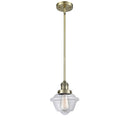 Oxford Mini Pendant shown in the Antique Brass finish with a Clear shade