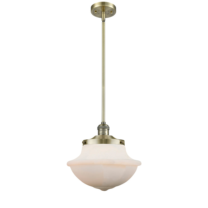 Oxford Mini Pendant shown in the Antique Brass finish with a Matte White shade