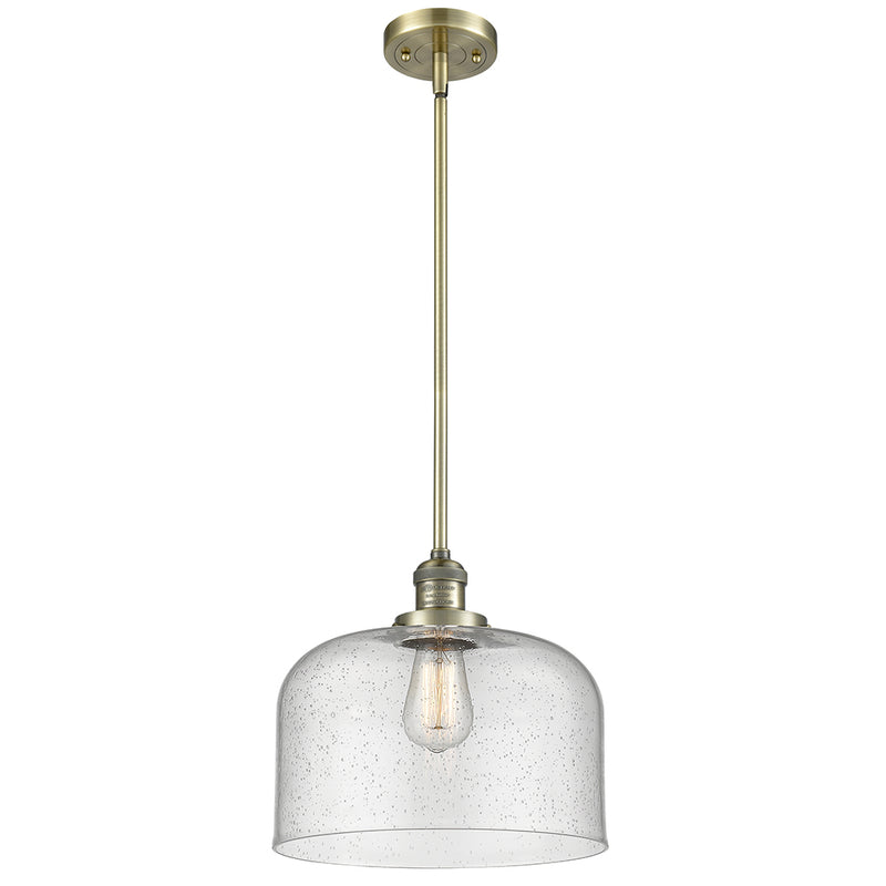 Bell Mini Pendant shown in the Antique Brass finish with a Seedy shade