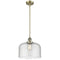 Bell Mini Pendant shown in the Antique Brass finish with a Seedy shade