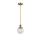 Beacon Mini Pendant shown in the Brushed Brass finish with a Clear shade