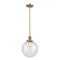 Beacon Mini Pendant shown in the Brushed Brass finish with a Seedy shade