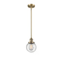 Beacon Mini Pendant shown in the Brushed Brass finish with a Seedy shade