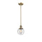 Beacon Mini Pendant shown in the Brushed Brass finish with a Seedy shade