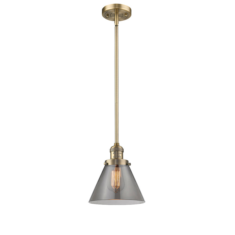 Cone Mini Pendant shown in the Brushed Brass finish with a Plated Smoke shade