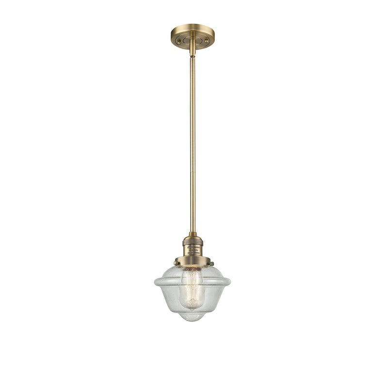 Oxford Mini Pendant shown in the Brushed Brass finish with a Seedy shade