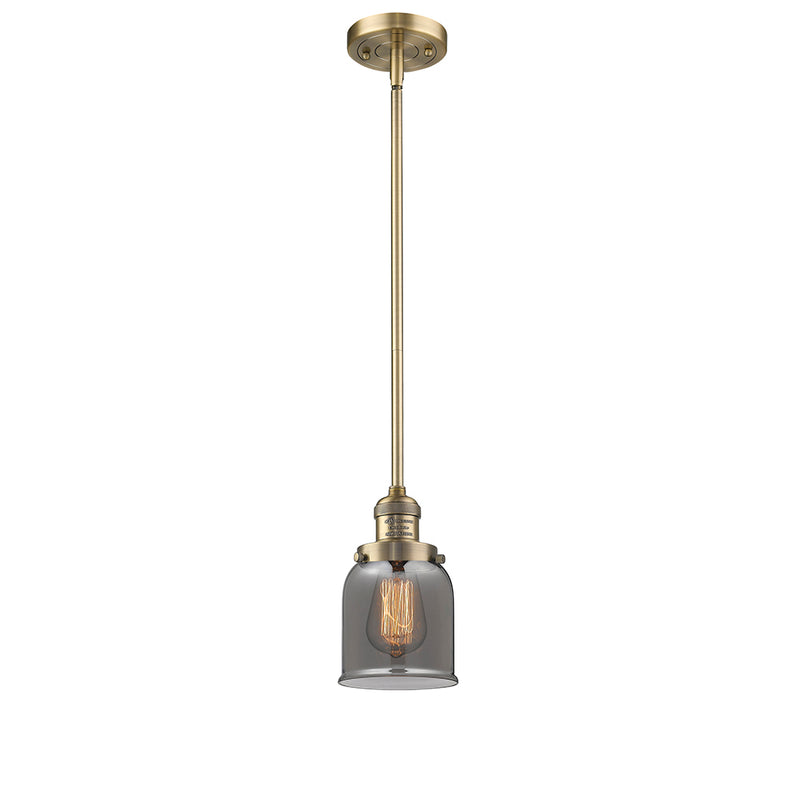 Bell Mini Pendant shown in the Brushed Brass finish with a Plated Smoke shade