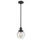 Beacon Mini Pendant shown in the Matte Black finish with a Seedy shade