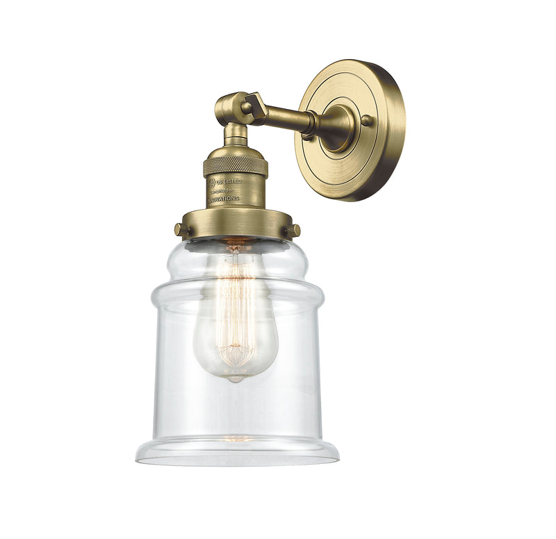 Innovations Lighting Canton 1-100 watt 6.5 inch Antique Brass Sconce with Clear glass and Solid Brass 180 Degree Adjustable Swivel With Engraved Cast Cup 203ABG182