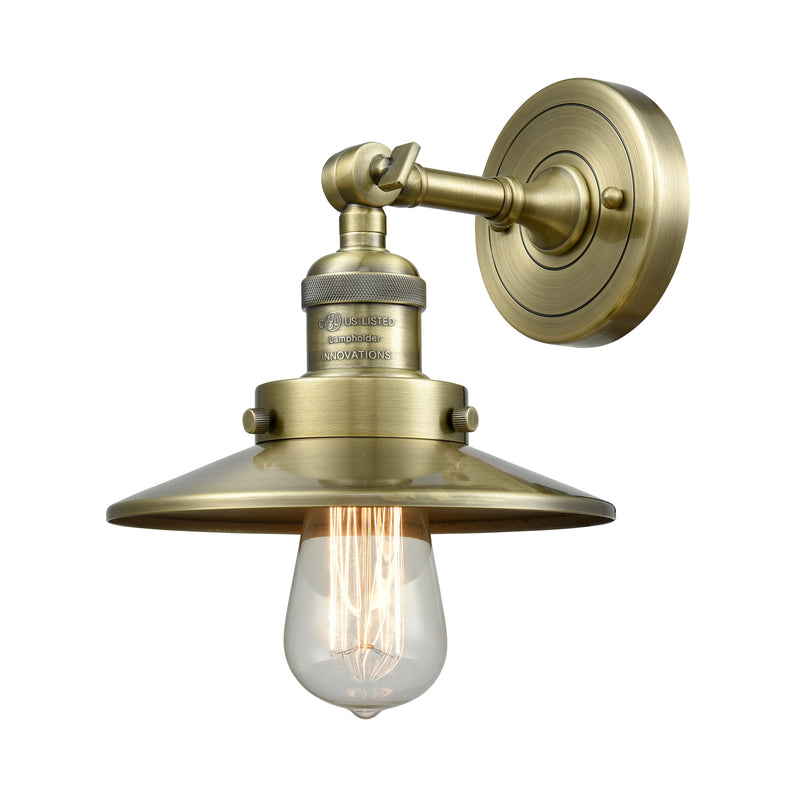 Railroad Sconce shown in the Antique Brass finish with a Antique Brass shade