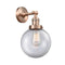 Beacon Sconce shown in the Antique Copper finish with a Clear shade