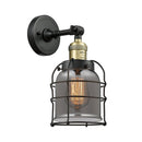 Bell Cage Sconce shown in the Black Antique Brass finish with a Plated Smoke shade