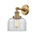 Bell Sconce shown in the Brushed Brass finish with a Clear shade