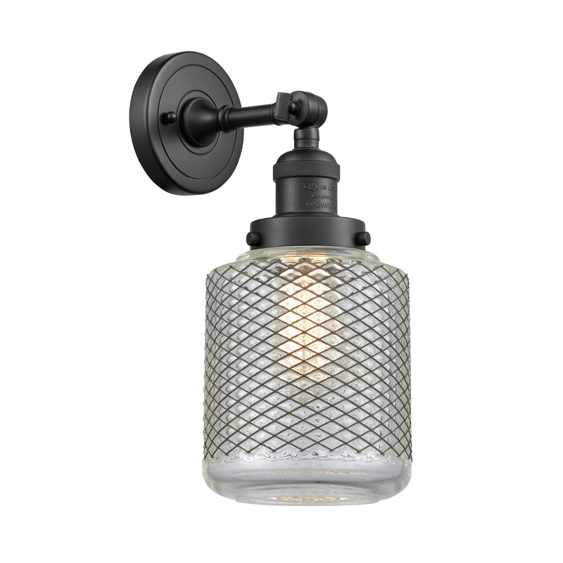 Stanton Sconce shown in the Matte Black finish with a Clear Wire Mesh shade