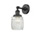 Colton Sconce shown in the Matte Black finish with a Clear Halophane shade