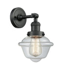 Oxford Sconce shown in the Matte Black finish with a Clear shade