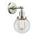 Beacon Sconce shown in the Polished Nickel finish with a Clear shade