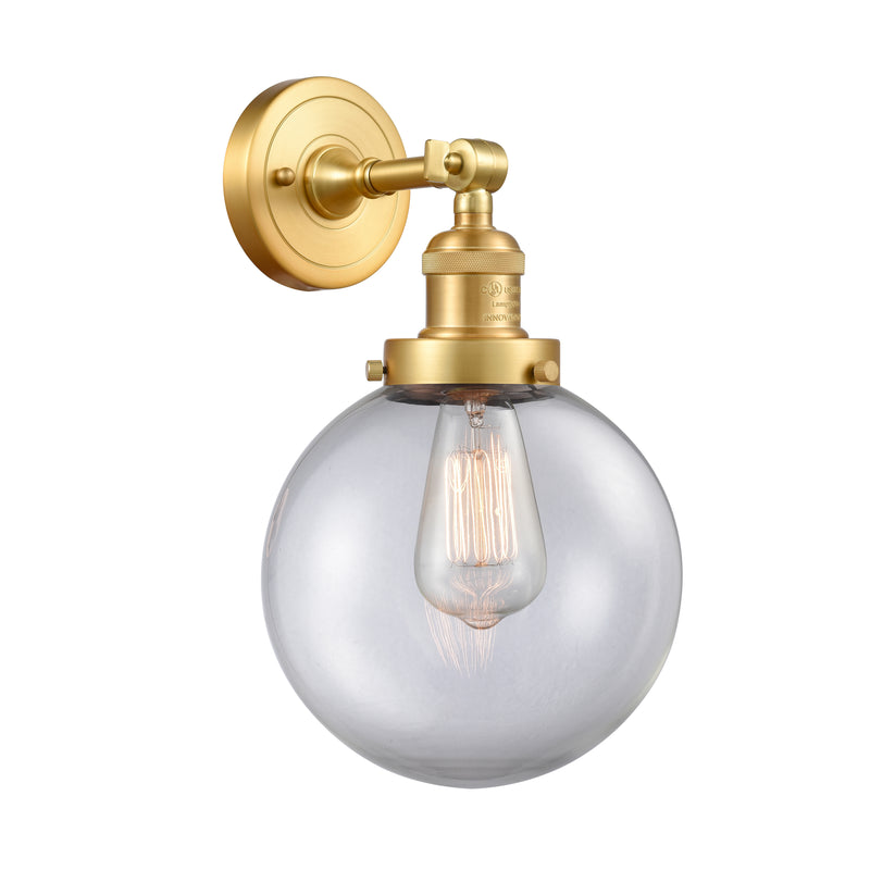 Beacon Sconce shown in the Satin Gold finish with a Clear shade