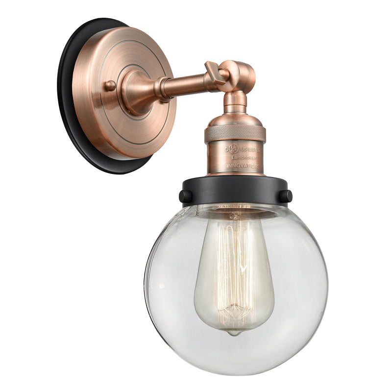 Beacon Sconce shown in the Antique Copper finish with a Clear shade