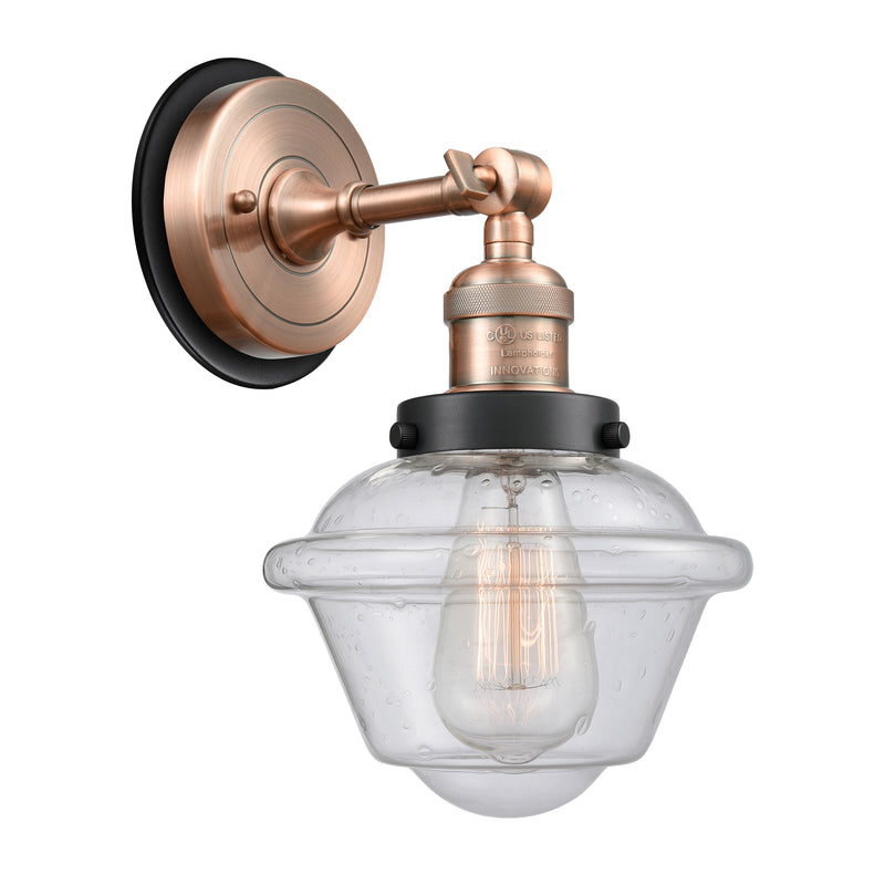 Oxford Sconce shown in the Antique Copper finish with a Seedy shade