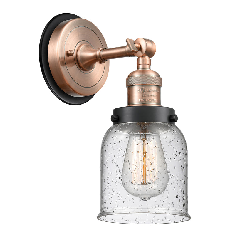 Bell Sconce shown in the Antique Copper finish with a Seedy shade