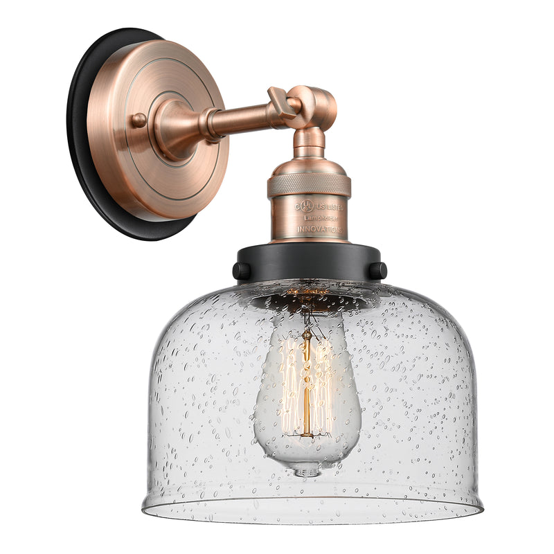 Bell Sconce shown in the Antique Copper finish with a Seedy shade