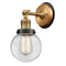 Beacon Sconce shown in the Brushed Brass finish with a Clear shade