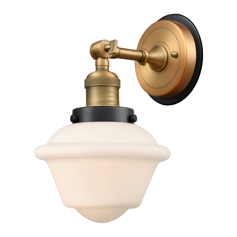 Oxford Sconce shown in the Brushed Brass finish with a Matte White shade