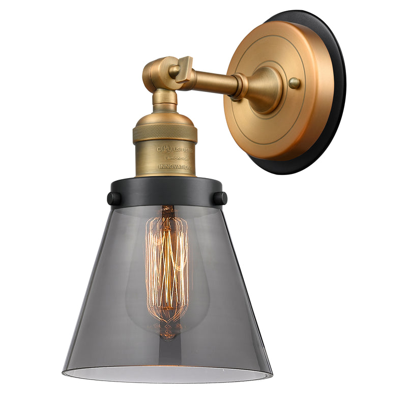 Cone Sconce shown in the Brushed Brass finish with a Plated Smoke shade