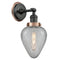 Geneseo Sconce shown in the Matte Black finish with a Clear Crackled shade