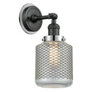 Stanton Sconce shown in the Matte Black finish with a Clear Wire Mesh shade