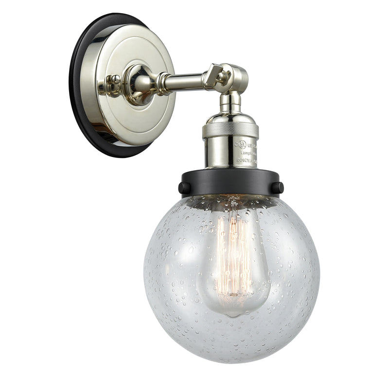 Beacon Sconce shown in the Polished Nickel finish with a Seedy shade