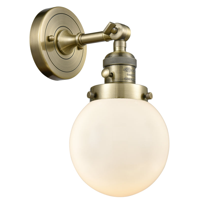 Beacon Sconce shown in the Antique Brass finish with a Matte White shade