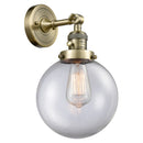 Beacon Sconce shown in the Antique Brass finish with a Clear shade