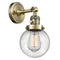 Beacon Sconce shown in the Antique Brass finish with a Seedy shade