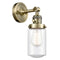 Dover Sconce shown in the Antique Brass finish with a Seedy shade