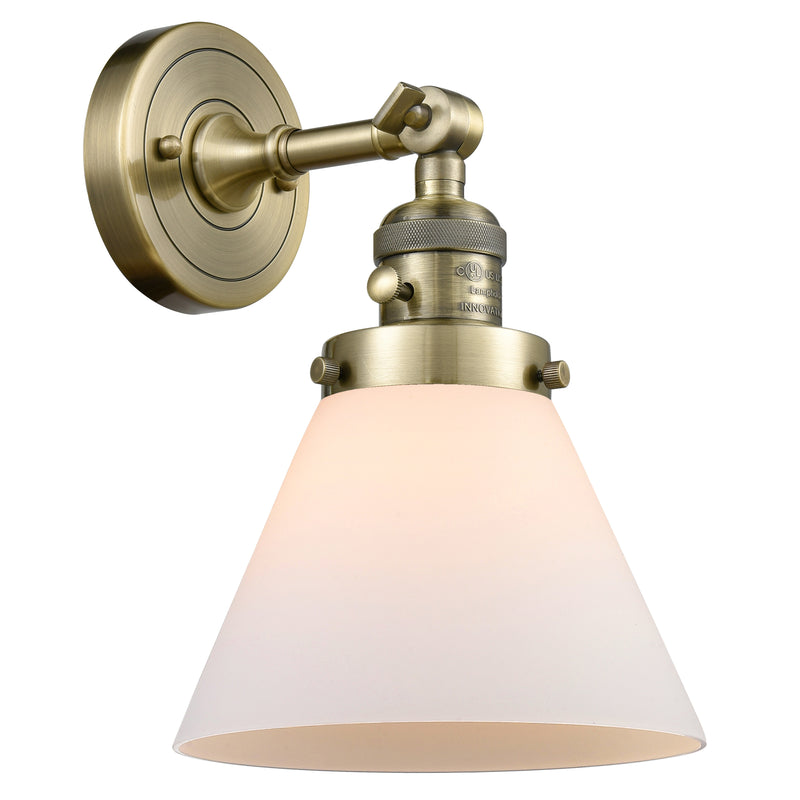 Cone Sconce shown in the Antique Brass finish with a Matte White shade