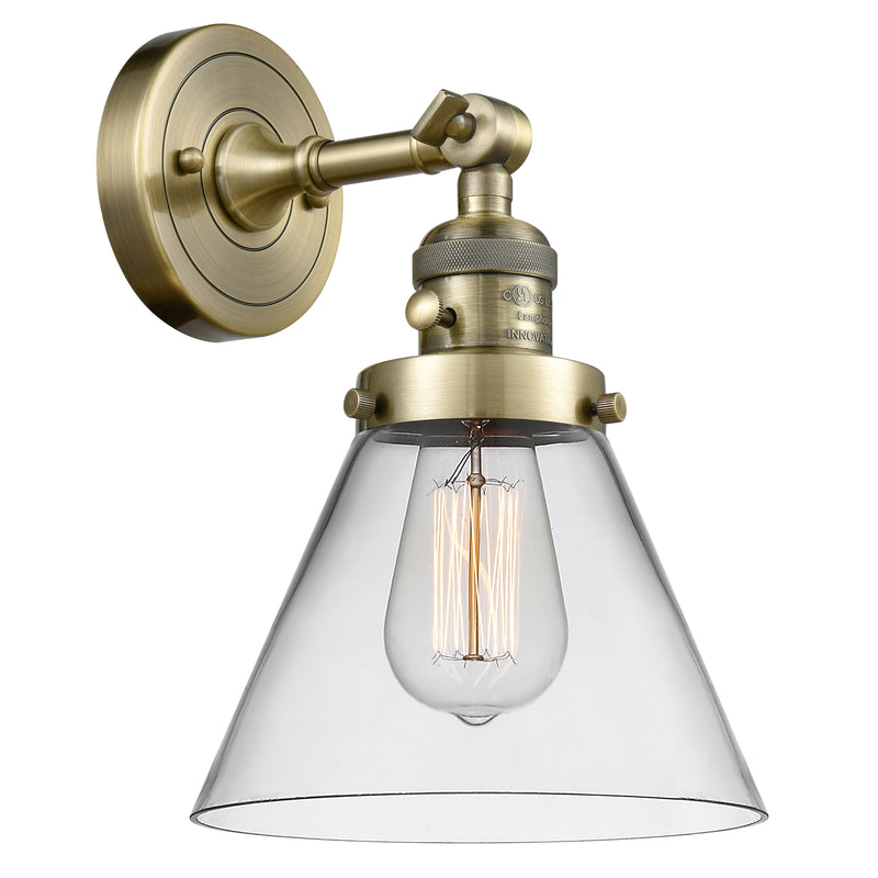 Cone Sconce shown in the Antique Brass finish with a Clear shade