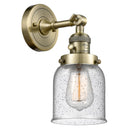 Bell Sconce shown in the Antique Brass finish with a Seedy shade