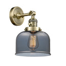 Bell Sconce shown in the Antique Brass finish with a Plated Smoke shade