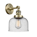 Innovations Lighting Large Bell 1-100 watt 8 inch Antique Brass Sconce with Seedy glass and Solid Brass 180 Degree Adjustable Swivel With Engraved Cast Cup Includes a "High-Low-Off" Switch. 203SWABG74