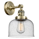 Bell Sconce shown in the Antique Brass finish with a Seedy shade