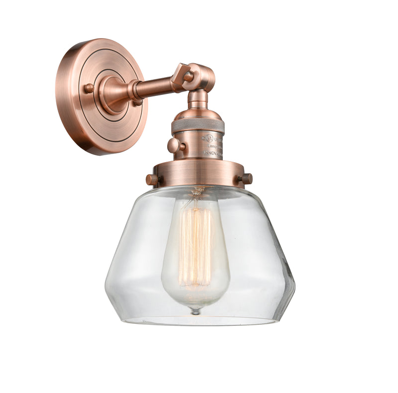 Innovations Lighting Fulton 1-100 watt 7 inch Antique Copper Sconce with Clear glass and Solid Brass 180 Degree Adjustable Swivel With Engraved Cast Cup Includes a "High-Low-Off" Switch. 203SWACG172