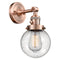 Beacon Sconce shown in the Antique Copper finish with a Seedy shade