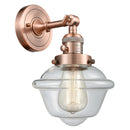 Oxford Sconce shown in the Antique Copper finish with a Clear shade