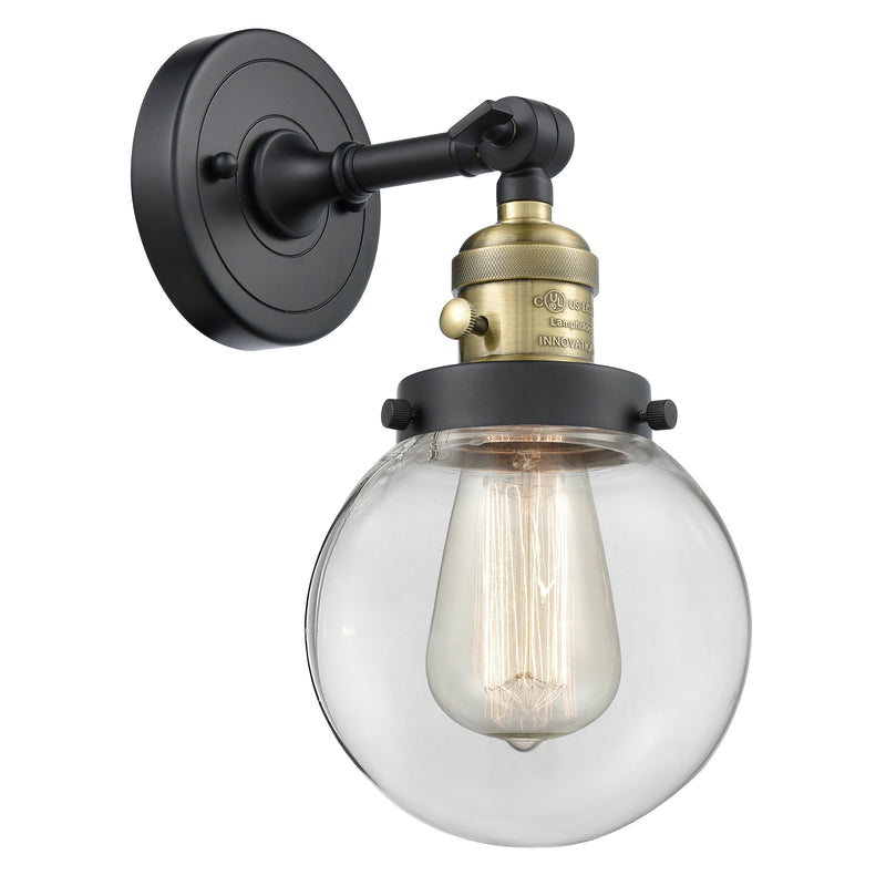 Beacon Sconce shown in the Black Antique Brass finish with a Clear shade