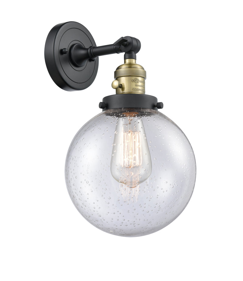 Innovations Lighting Beacon 1-100 watt 8 inch Black Antique Brass Sconce with Seedy glass and Solid Brass 180 Degree Adjustable Swivel With Engraved Cast Cup Includes a "High-Low-Off" Switch. 203SWBABG2048