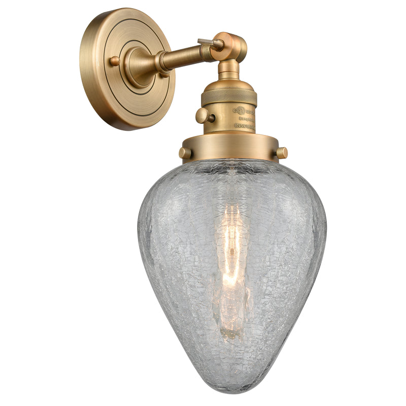 Geneseo Sconce shown in the Brushed Brass finish with a Clear Crackled shade