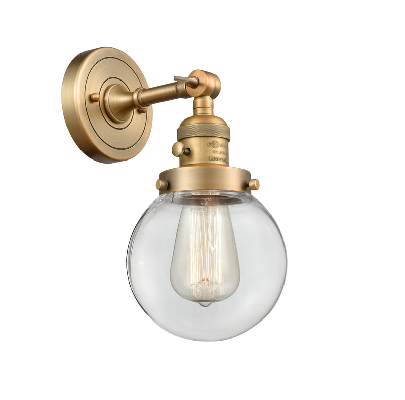 Innovations Lighting Beacon 1-100 watt 6 inch Brushed Brass Sconce with Clear glass and Solid Brass 180 Degree Adjustable Swivel With Engraved Cast Cup Includes a "High-Low-Off" Switch. 203SWBBG2026