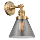 Cone Sconce shown in the Brushed Brass finish with a Plated Smoke shade